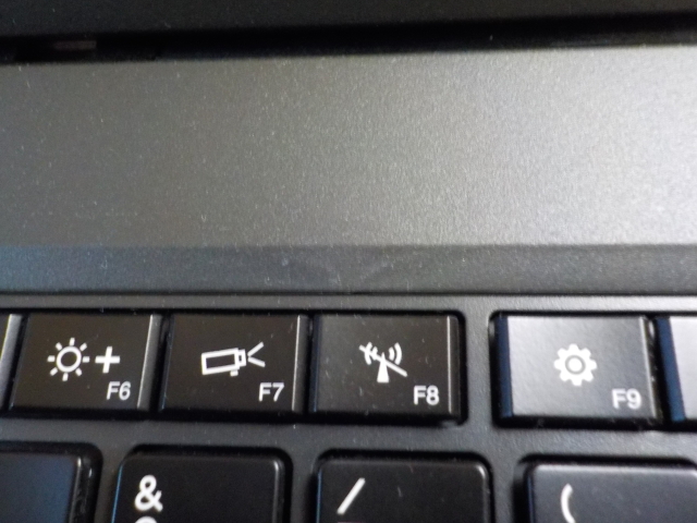 It probably wouldn't show up in black. Some homogeneity issue on the palm-rest, next to the F8 key.